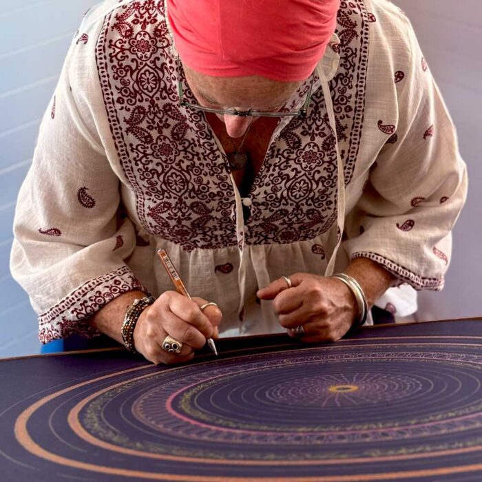 Liz Collins from Alignment Retreats creating a personalised mandala