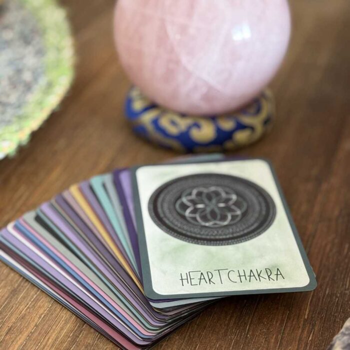 Sacred Codes of the Mandala Oracle deck with rose quartz